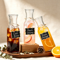 Carafe à jus en verre sodocalcique de qualité alimentaire de 1000 ml, carrée, avec col étroit et bec verseur large pour usage en restaurant