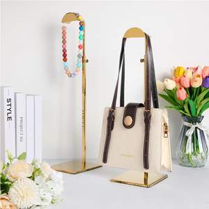 AURORA Factory Vente chaude Support de présentation de sac suspendu en acier inoxydable doré de haute qualité personnalisé pour les vêtements - Product Image 6