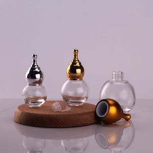 Muestra Gratuita de Botella Redonda de Vidrio para Aromaterapia de 10ml 20ml 30ml 50ml, Botella para Esencia Capilar Antigua con Tapa Dorada en Forma de Calabaza - Product Image 1