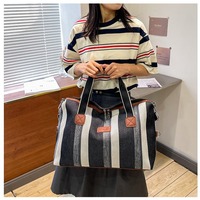 Vente en gros de sac de voyage courte distance rayé à la mode sac fourre-tout en toile épaisse de style japonais unisexe avec fermeture éclair imperméable grand