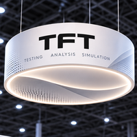 Conception de stand d'exposition en forme de L sur mesure 10x20 pieds |   Boîte à lumière suspendue, espace ouvert, écrans de présentation et zone de réunion pour NI Connect 2027