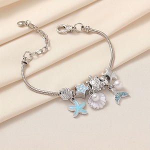 Pulsera de dijes con cuentas estilo marino, con colgantes esmaltados de estrella de mar, cola de sirena y delfín, ajustable, joyería DIY para mujeres y niñas - Product Image 2