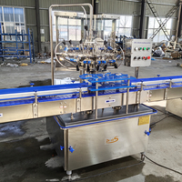 Machine de remplissage de liquide de bouteille entièrement automatique Machine d'embouteillage de vin de whisky Machine de remplissage de vin de liqueur de vodka de spiritueux