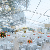 Tente de réception de luxe TENTCHO à structure en aluminium avec toit en PVC transparent et murs en verre pour événements de mariage en plein air