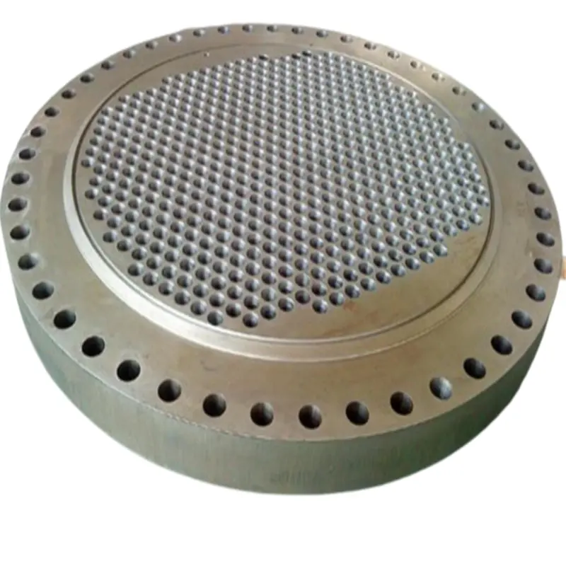 Precision machined stainless steel tube sheet by multi-hole drilling