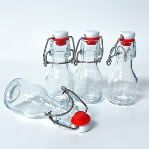 Envase de Vidrio Reutilizable con Tapa Abatible y Tapón de Goma Hermético para Almacenamiento de Té Frío, Aceite de Oliva, Vinagre y Condimentos de Cocina - Product Image 1