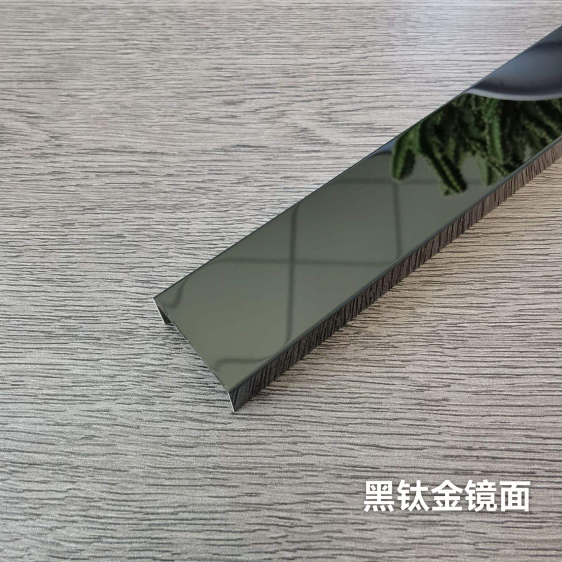 Black titanium mirror