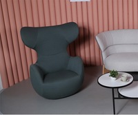 Fauteuil lounge moderne à dossier haut avec base pivotante pour hall d'hôtel et réception