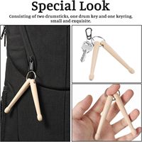 Vente en gros de porte-clés en bois de 9 cm avec logo personnalisé pour accessoires d'instruments de musique