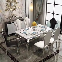 Ensemble de table à manger moderne de luxe en acier inoxydable avec dessus en marbre pour le salon ou la cuisine de l'appartement