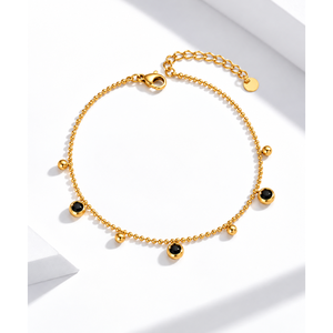 Bracelet en acier inoxydable plaqué or 14 carats avec breloques circulaires en onyx noir et fermoir mousqueton - Product Image 1