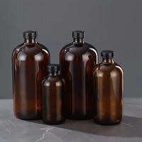 Bouteille d'huile essentielle en verre ambré de grande taille, ronde, de type Boston, avec bouchon à vis noir, disponible en 15 ml, 30 ml, 60 ml, 120 ml, 250 ml et 500 ml.