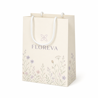 Sacs en papier d'art pour vêtements, imprimé floral, poignées en corde blanche, emballage de mode pour vêtements, vente en gros, fourniture directe d'usine