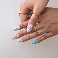 Offre Spéciale – Ongles à Presser en Acrylique Effet Marbre Frais Glacé Teinte Bleue, Motif Fleur Bleue et Blanche, Perle Amande – Certifiés, Vente en Gros, Personnalisables