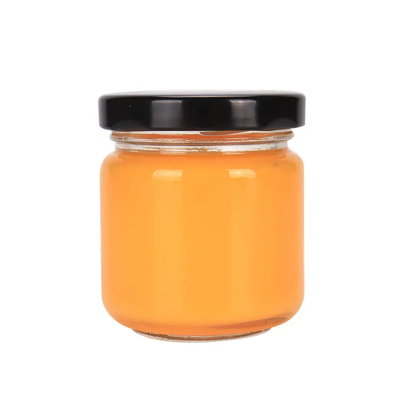 Commercio all'ingrosso mini 2oz 3oz 5oz chiaro vetro rotondo a buon mercato miele marmellata di barattoli di cibo con coperchi regalo barattolo di miele