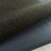 100% Poliéster imitación memoria T400 tejido elástico unido con forro polar negro para chaqueta Softshell