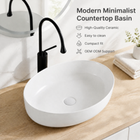 Vasque ovale en céramique de style minimaliste, à poser sur comptoir, pour salle de bain d'hôtel