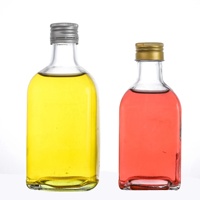Bouteille à liqueur cylindrique en verre à fond épais transparent pour usage professionnel en bar
