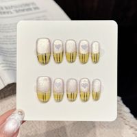 Faux ongles à presser en acrylique faits main, motif œil de chat jaune à carreaux, forme carrée moyenne, avec détails argentés et blancs scintillants, cœur ajouré et ligne peinte à la main