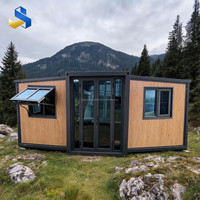 Maison conteneur moderne extensible et respirante de 20 pieds avec porte coulissante en bois naturel et cuisine pour studio de jardin