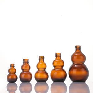 Fabrik preis Probe Kostenlos 10ml 20ml 30ml Doppel kürbis form Bernstein ätherisches Öl Glas Tropf flasche mit Gold Blumen korb kappe - Product Image 4