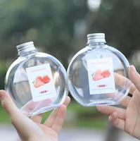 BPA gratuit en gros plastique PET jetable créatif 300ml 500ml plat rond boisson jus juteux fruits bouteille de vin