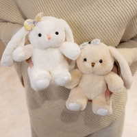 Peluche Lapin aux Oreilles Tombantes Moelleuse, Adorable Lapin Assis Blanc Beige avec Nœud en Velours Fleuri, Idéal pour Cadeau d'Anniversaire ou Décoration pour Enfants