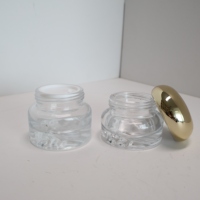 Pot de crème cosmétique en verre écologique de luxe Conception de fond de volcan Nouveau sérum de luxe pour les soins de la peau Crème pour les yeux Caractéristiques Bouteilles en verre