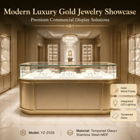 Vitrine à bijoux de luxe sur mesure avec cadre en métal doré et éclairage LED pour magasin de détail haut de gamme