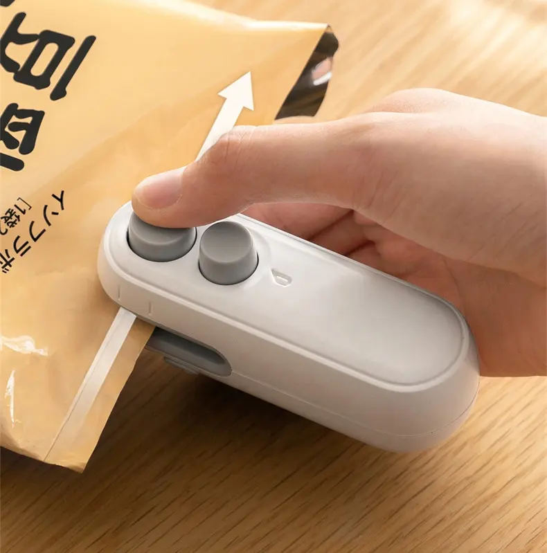 Yeni USB şarj edilebilir ev gıda tasarrufu ambalaj aperatif depolama paketleme makinesi el taşınabilir ısı Mini çanta mühürleyen