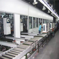Ligne de convoyeur à tambours industrielle robuste et sur mesure pour applications spéciales, destinée à l'assemblage de climatiseurs et de réfrigérateurs.