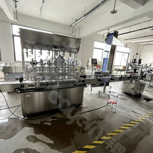 Machine automatique de remplissage, d'étiquetage et de scellage de bouteilles pour jus, liquides, eau, miel et pâte, avec fermeture de bouchons - Product Image 1