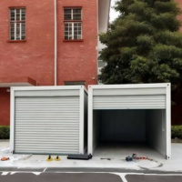 Maison mobile de conteneur de boîte de garage de voiture en acier préfabriquée portative moderne avec la porte de volet de roulement pour des entrepôts