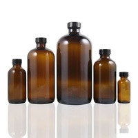 Bouteille d'huile essentielle en verre ambré de grande taille, ronde, de type Boston, avec bouchon à vis noir, disponible en 15 ml, 30 ml, 60 ml, 120 ml, 250 ml et 500 ml.