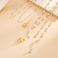 Ensemble de colliers élégants avec nœud papillon et pendentif cœur en imitation perle pour femmes, accessoires de fête tendance pour dames, collier ras du cou empilable, bijoux
