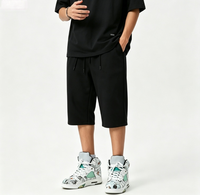 Shorts amples noirs pour hommes, longueur genou, avec double cordon de serrage, coupe ample, personnalisables, vente en gros