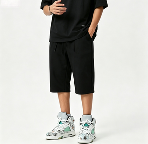 Shorts amples noirs pour hommes, longueur genou, avec double cordon de serrage, coupe ample, personnalisables, vente en gros - Product Image 1