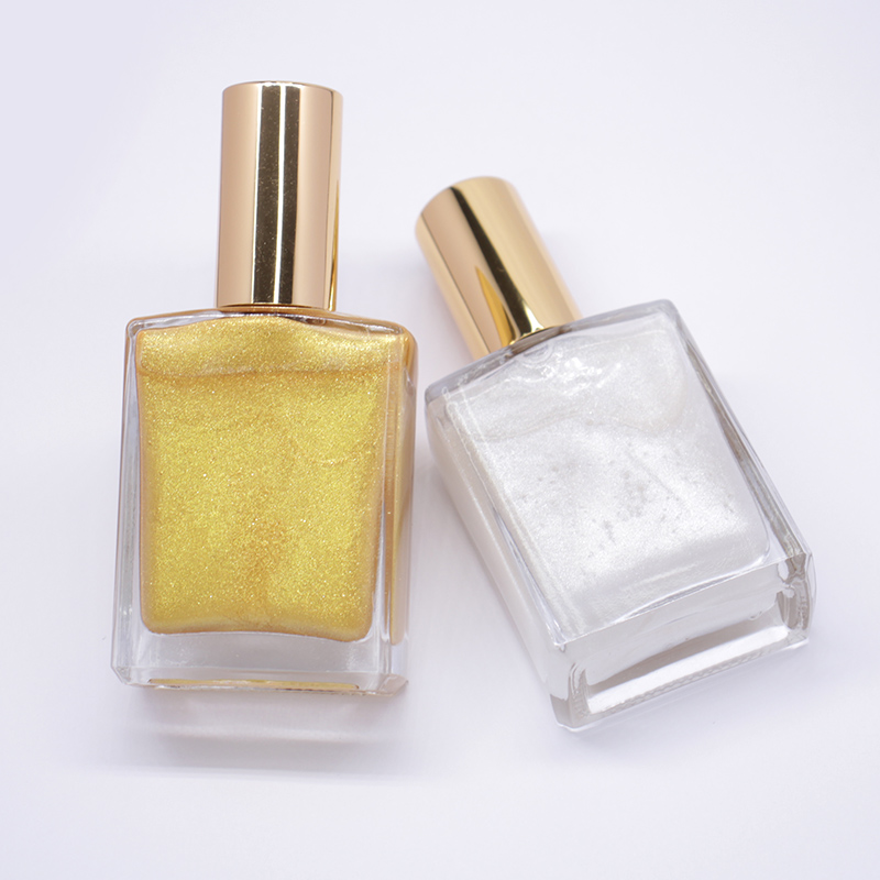 gold body oil bottle