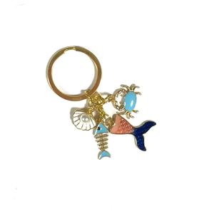 Llavero <span class=keywords><strong>de</strong></span> recuerdo <span class=keywords><strong>de</strong></span> playa único con múltiples dijes: Anillo dorado, <span class=keywords><strong>Cangrejo</strong></span> morado, Delfín <span class=keywords><strong>rojo</strong></span>, Pez azul, Esqueleto, Cola <span class=keywords><strong>de</strong></span> sirena. Regalo. - Product Image 3