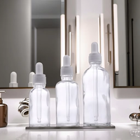 Flacon compte-gouttes en verre cylindrique personnalisable pour les soins de la peau de 15ml 30ml 50ml 100ml Capacités Plat Vide Sérum Emballage Vis gratuite