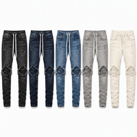 Jean skinny homme en coton stretch déchiré aux genoux, avec cordon de serrage, denim délavé noir, style streetwear