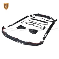 Kit de carrocería de fibra de carbono seca estilo SQ para BMW X6M F96: Labio delantero, rejillas de ventilación OEM, faldones laterales, difusor trasero, alerón de techo y molduras de guardabarros.