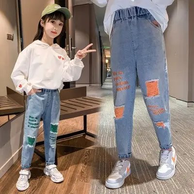 Femminile Tong Chunqiu 2020 dei nuovi bambini di modo dei jeans del foro pantaloni grande vergine dei capretti dei pantaloni dei jeans delle ragazze