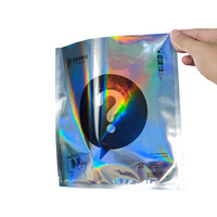 Sac d'emballage cadeau surprise coloré personnalisé PVC vide point d'interrogation film laser sac aveugle avec motif imprimé