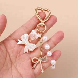 Porte-clés en forme de cœur, porte-clés décoratif pour femme avec nœud en perles et strass, pendentif de sac, cadeau - Product Image 2