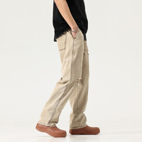 Vente en gros de pantalons en jeans pour hommes vieillis, nouveauté pantalons de travail en denim délavés à la pierre pantalons en jean pour hommes