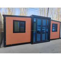 Maison conteneur contemporaine extensible à double aile, studio mobile pour nomades numériques, configuration complète, revêtement de sol en SPC (Stone Plastic Composite)