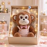 Peluche singe marron en gros, jouet animal en peluche avec tenue de fête, logo personnalisé pour boutique de cadeaux, machine à griffes de distributeur automatique