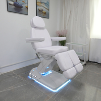 Chaise de tatoueur moderne haut de gamme lit de spa électrique réglable pour le visage table de massage de salon de beauté avec lampe à led