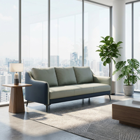 Canapé en cuir moderne, style minimaliste, avec pieds en métal élégants, pour un salon de bureau luxueux